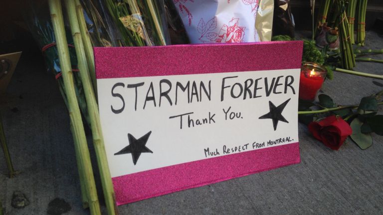 Fans place tributes outside of David Bowie's New York City apartment after his death on Jan. 10, 2016.