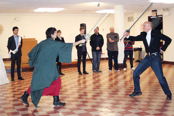 In the land of pages, gamers stage this 2 The Prince (Eduardo Perez) and Lords (Kristen Hendricks, Stefan Huber, Brian Farr and Steve Chang) watch an unusual twist of events as Lady Jade (Nicole Orabona) challenges Lord Paleos Kalbrock (Jeff Wirth) to a duel. Photo by Liz Susman Karp.