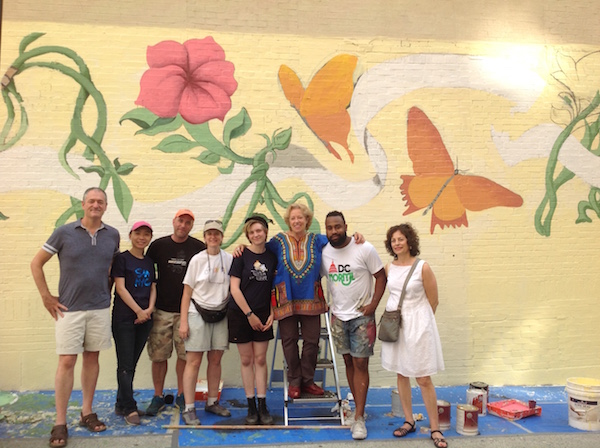 CITYarts Seeks Support for Chelsea Mural Projects 6 Tsipi Ben-Haim (on ladder) and volunteers during the restoration of “The Nature of This Flower is to Bloom,” a CITYarts mural at W. 92nd St. & Broadway. Photo courtesy CITYarts.