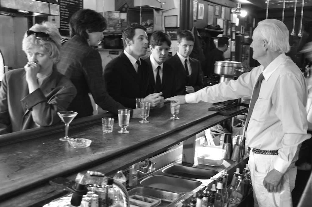 A recreation of the scene in April 1966 when John Timmins, Dick Leitsch, Craig Rodwell and Randy Wicker were denied drinks at the Mattachine Society sip-in at Julius’ Bar. 