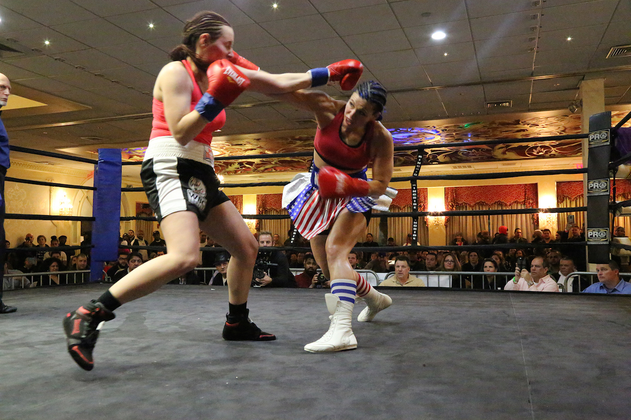 Alicia “The Empress” Napoleon, right, lands a right against Szilvia Szabados in their title bout last week.   Photos by Clayton Patterson