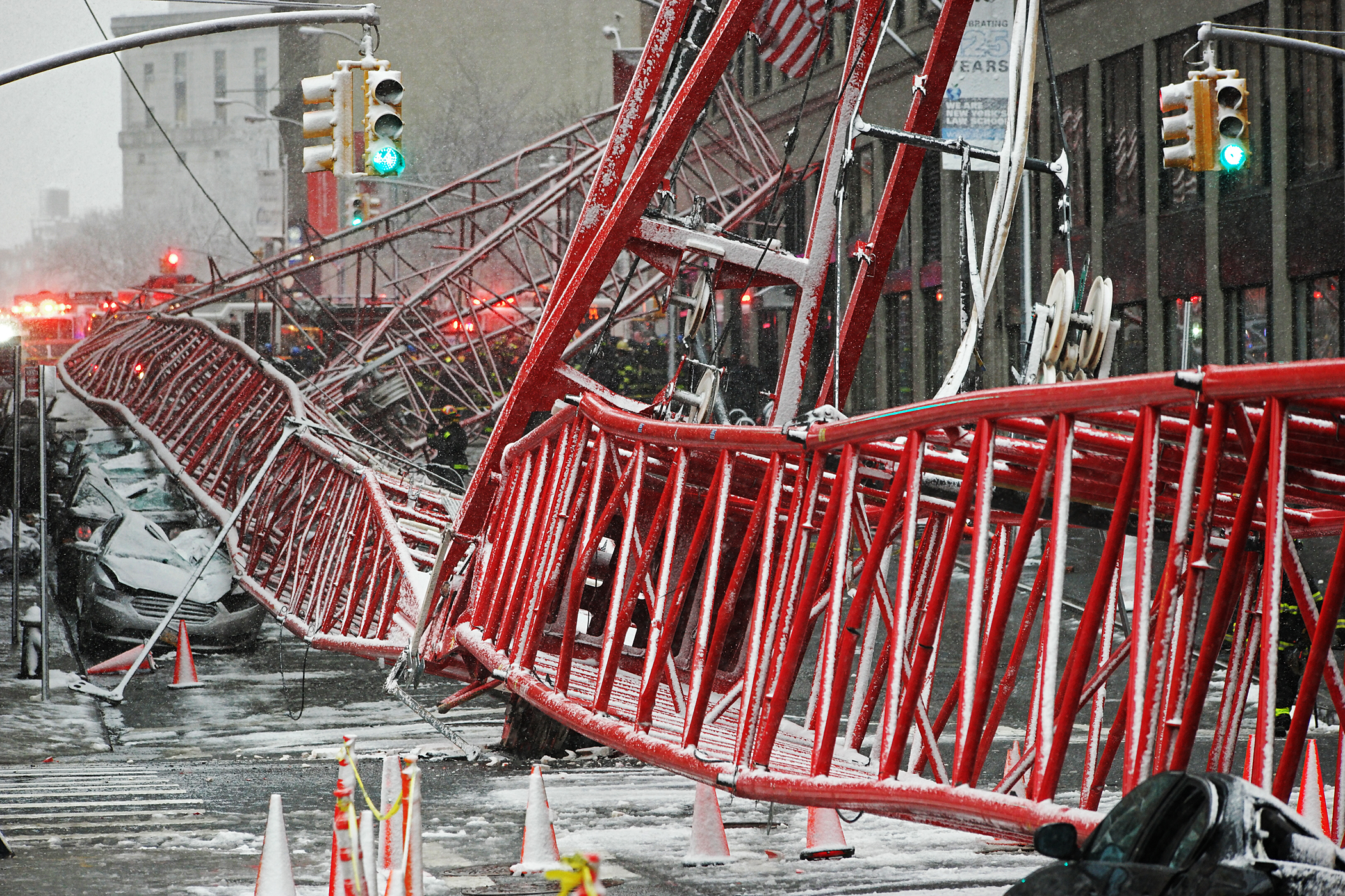 Photo by Milo Hess The falling crane killed one person and crushed several cars parked along Worth St. 