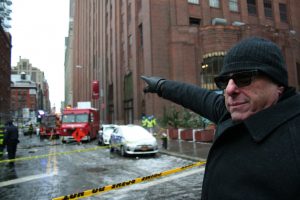 Photo by Yannic Rack Bruce Ehrmann points to his building on the Worth St. block where the crane collapsed.