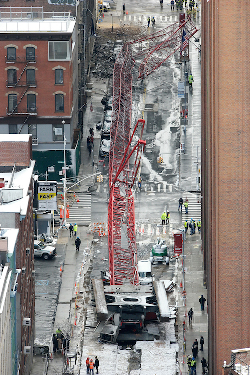 The crane's cab somersaulted and landed upside-down. 