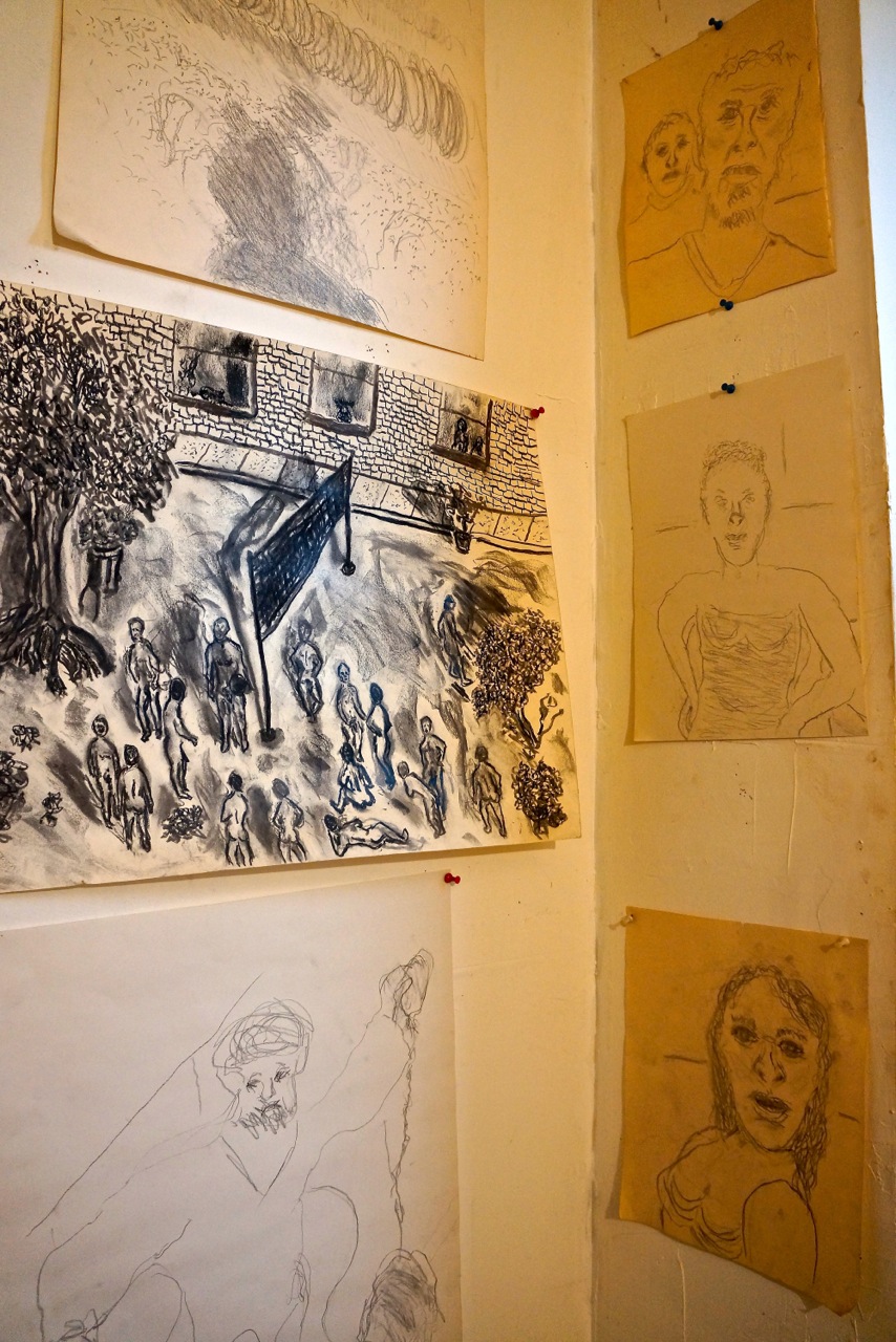 Some of the drawings that covered the walls of Farris’s apartment where he died.   Photo by Sarah Ferguson