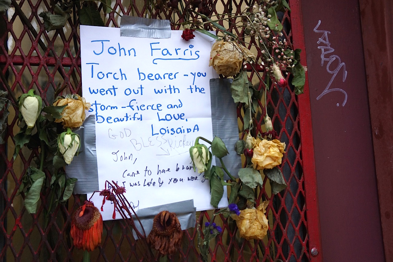 A memorial note to Farris on the front door of Bullet Space.  Photo by Sarah Ferguson