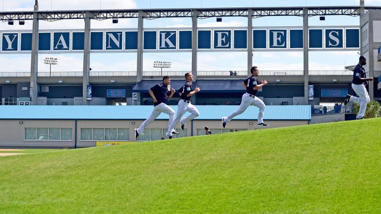 The New York Yankees work out on the hill at Field 3 of George M. Steinbrenner Field during spring training in Tampa, Fla. on Sunday, Feb. 21, 2016.