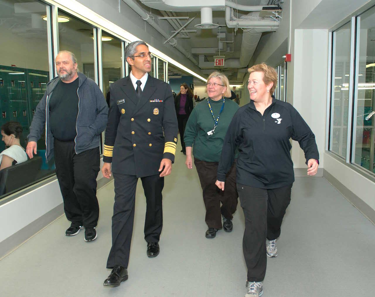 Better health is a walk in the park — or the gym: During his recent visit to the McBurney YMCA on W. 14th St., Surgeon General Vivek Murthy took a brisk walk on the jogging track with, from left, Paul Groncki, Rita Fischer and Ruth Gursky, as they discussed the benefits of walking.  Photo by Raymond Liang 