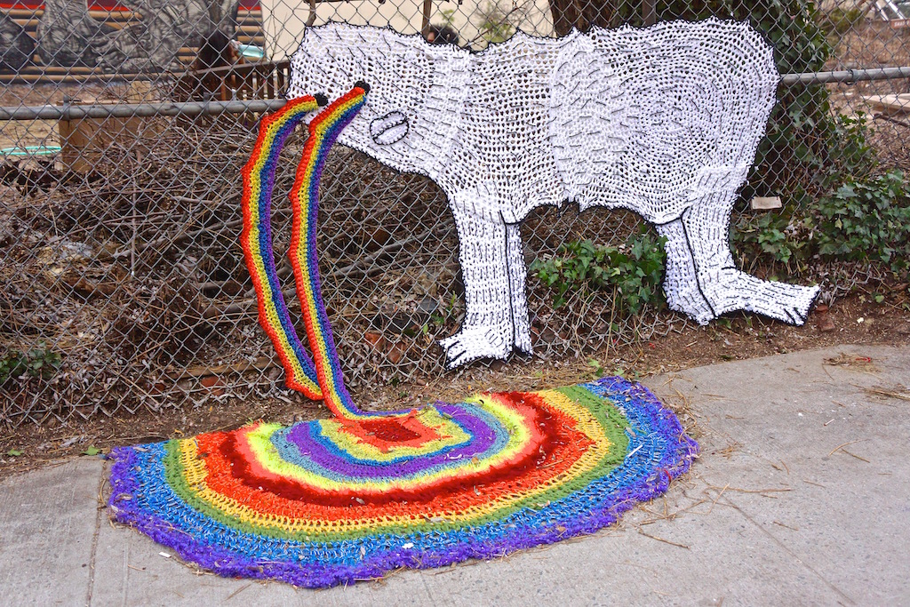 This knit artwork by artist London Kaye appeared on the fence and sidewalk at La Plaza Cultural community garden, at E. Ninth St. and Avenue C, last week. Interpret it however you wish — or maybe not!  Photo by Sarah Ferguson