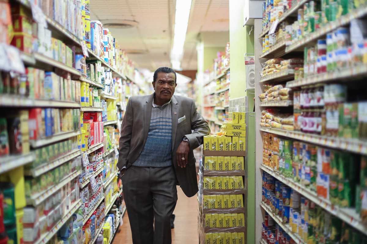 Fighting to keep budget food market from having to check out on 14th St. 1 Associated, Gladwin Francis, p. 1-2