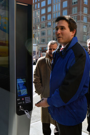 Upper East Side Wi-Fi Kiosks Up and Running 1 After making a call to his office, Councilmember Ben Kallos charges up his cellphone. | JACKSON CHEN