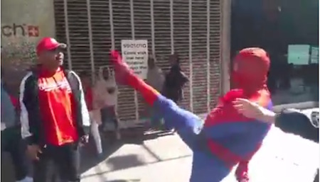 Spider-Man does a theatrical kick in his confrontation with Rodney Merrill, over a disputed promised tip. | FACEBOOK.COM 