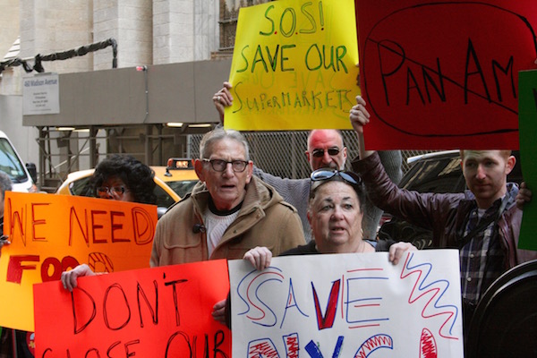 Locals Rally to Extend Supermarket’s Shelf Life 2 Charles Bayor and Francine Haselkorn, front center, followed Councilmember Corey Johnson’s rallying cry to take the battle for the Associated supermarket Uptown. Photo by Yannic Rack.