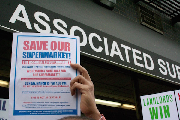 Time to Look at Bigger Picture on Small Businesses 2 Protesters waved flyers and signs at the Mar. 13 demonstration, which took place in front of the store that many of them have frequented for decades. Photo by Yannic Rack.