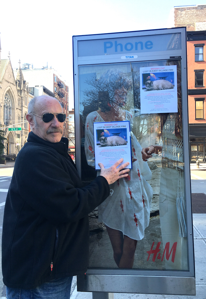 One year later: Rising from a tragedy’s ashes 14 Stuart Lipsky once again put up missing-cat posters on Saturday for Ryce, his family's cat that has been missing since the explosion last year. He was able to save the family's other cat before dashing out of their home at 125 Second Ave., but didn't have time to grab Ryce. Photo by Tina Benitez-Eves
