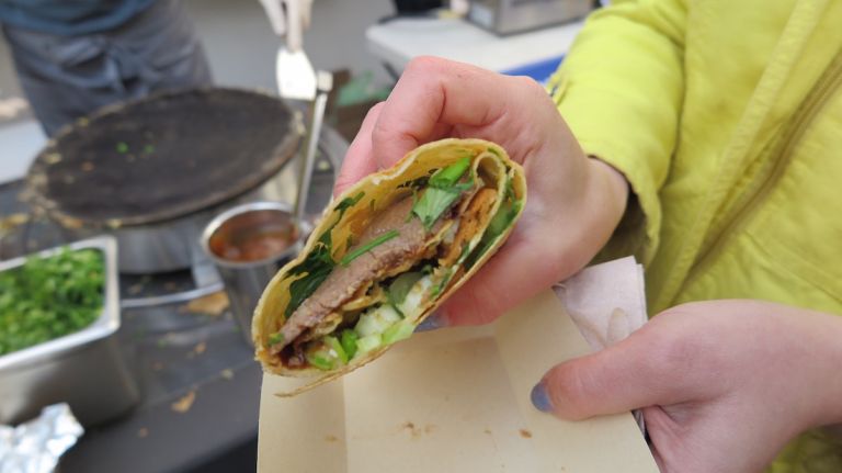 Inspired by the Shanghai classic Chinese street breakfast, the Jianbing is a pancake wrap that is savory and sweet. Inside the wrap: sausage (the one ingredient not traditional), a deep fried crisp, scallions and cilantro and two sauces, 13 sauce (tian mian jiang) and the crack (ciubing). 