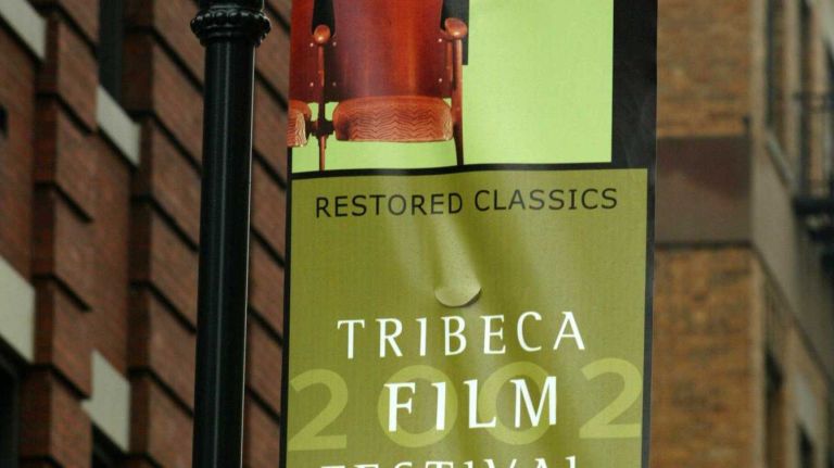 Banners hang on the street lamps in TriBeCa to announce the opening of the Tribeca Film Festival on May 2, 2002.