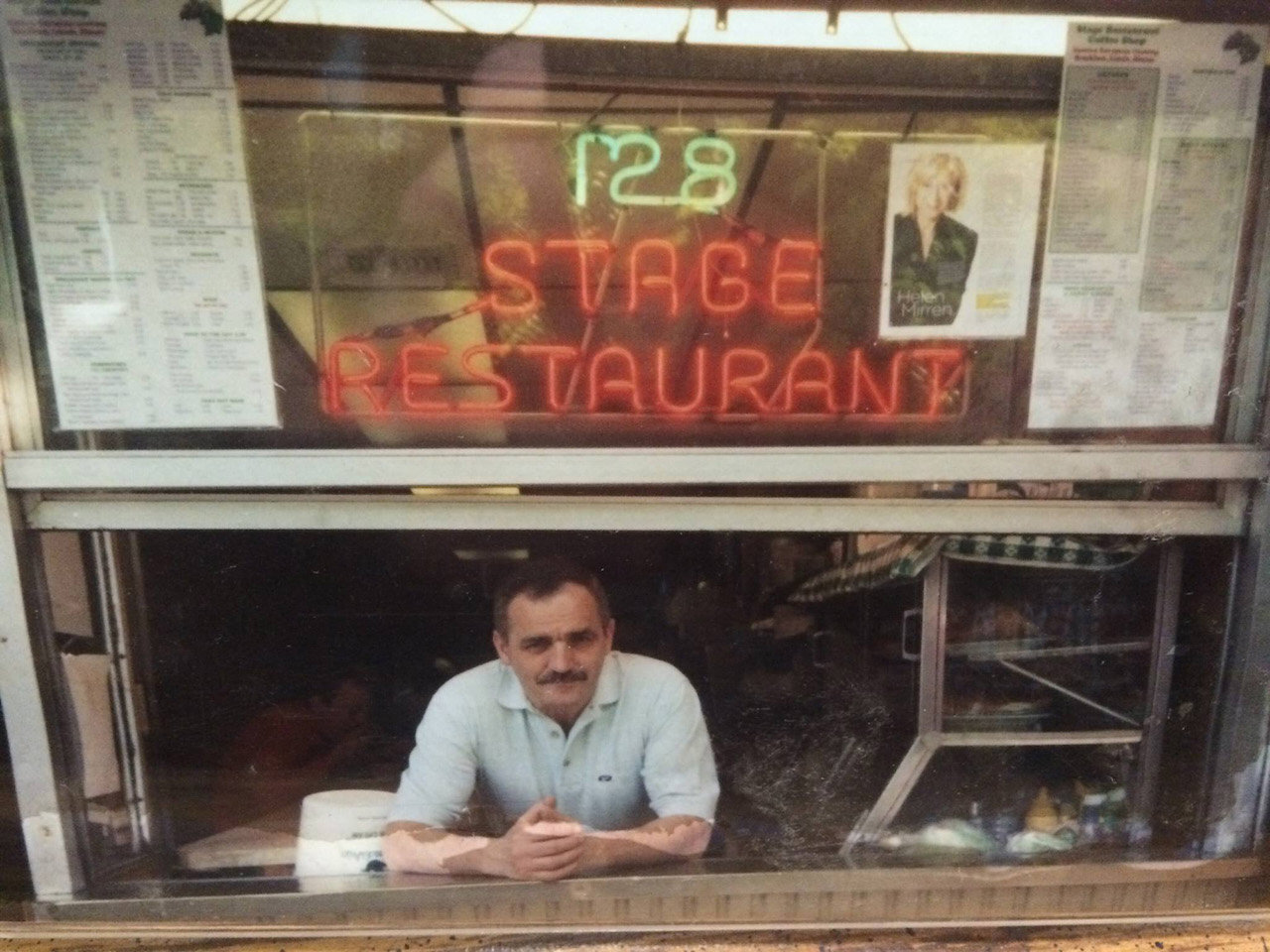 Roman Diakun in the front window of his Stage Restaurant on Second Ave. He recently announced he won’t be reopening. 