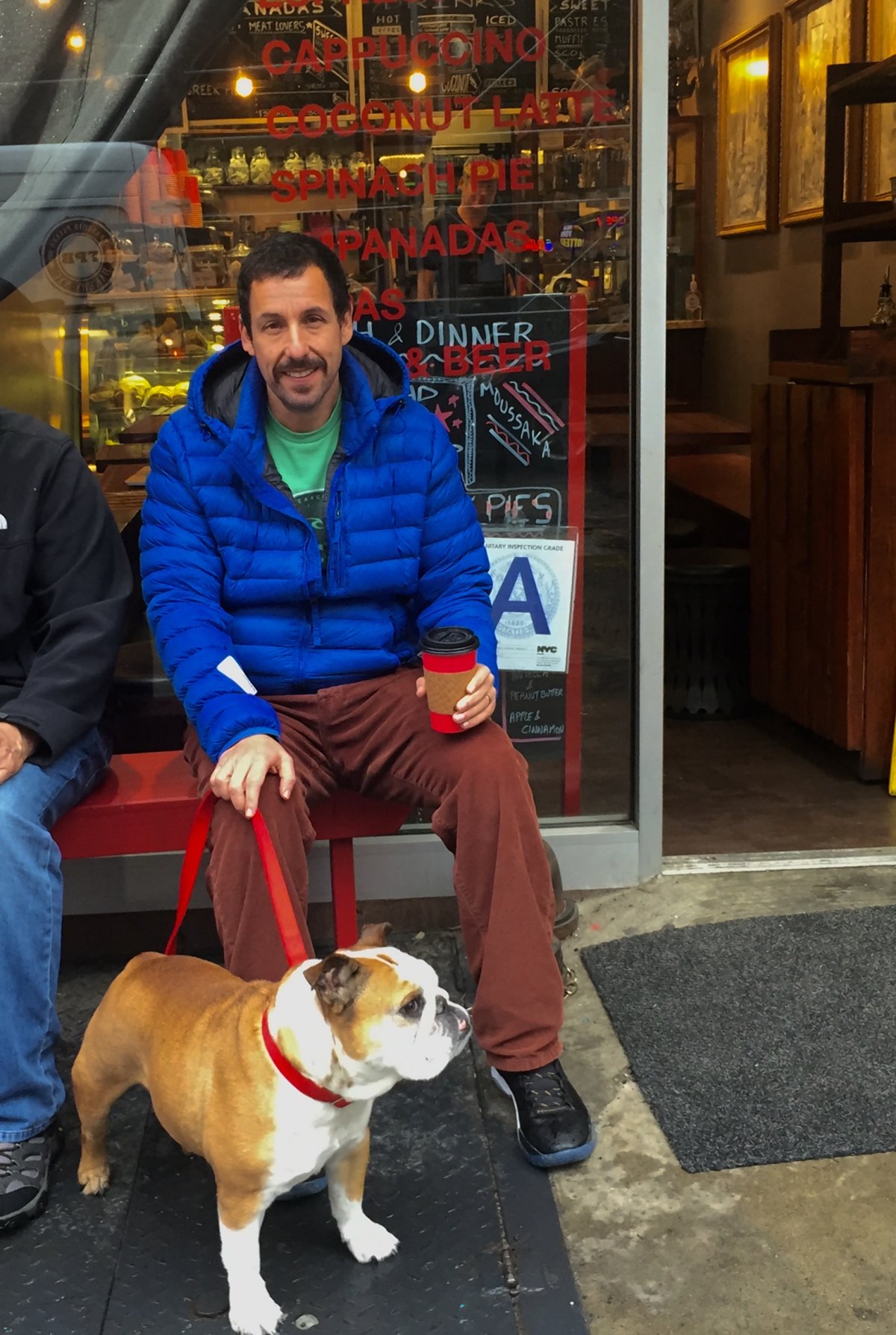 Scoopy’s Notebook, Week of April 28, 2016 2 Actor Adam Sandler with his dog, Babu Sandler, chilled on the bench outside The Frog’s Crown on Spring st. near Sixth Ave. Maybe we will be seeing more of the Saddlers since this cafe is actually our photographer’s “office.” Photo by Tequila Minsky