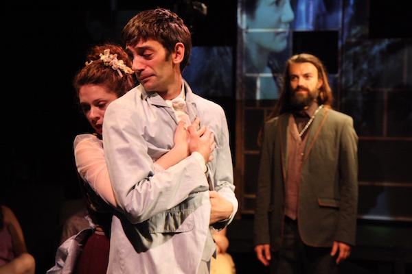 Immersive ‘Idiot’ is stripped-down Dostoevsky, ready to party 1 L to R: Lauren Cipoletti (hugging), Daniel Kublick and Merlin Whitehawk. Photo by Carl Skutsch.