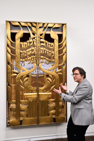 Congregation Beit Simchat Torah: Coming Out and Coming Home 2 Rabbi Kleinbaum shows one of Congregation Beit Simchat Torah’s five Torahs. Photo by Donna Aceto.