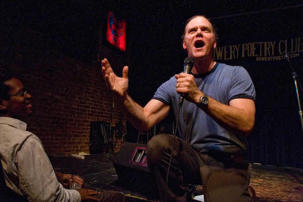 Trading fours at Page Meets Stage 3 Taylor Mali at Bowery Poetry Club, during one of the first Stage Meets Page pairings. Photo by Peter Dressel.