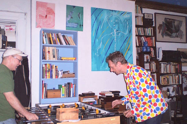 These are the days of chintz and change 5 L to R: Ed Hamilton, in his room at the Chelsea Hotel, playing foosball with punk rocker Bruno Wizard, who was a guest at the hotel in 2006. Photo by Debbie Martin.