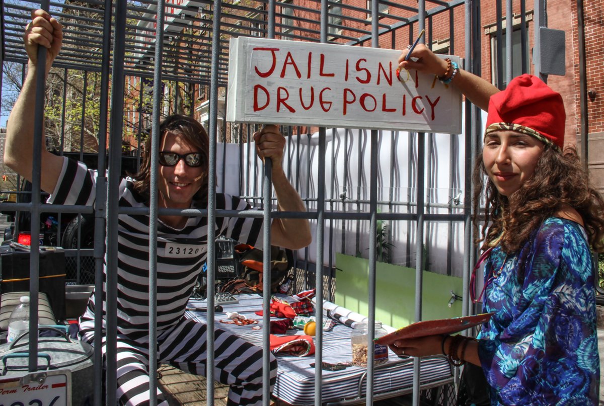 Pot legalization advocates recently made their cage...or rather, case…in Washington Square.  Photo by Tequila Minsky