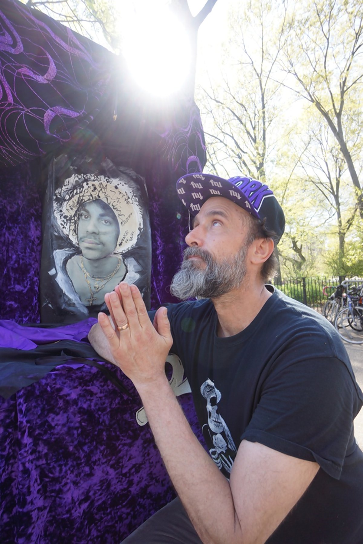 West Villager Albert Wilking brought a velvet Prince shrine that he created to Tompkins Square Park last Sunday — coincidentally, right as a pop-up dance party on bicycles for the Purple One was rolling in.  Photos by Sarah Ferguson 