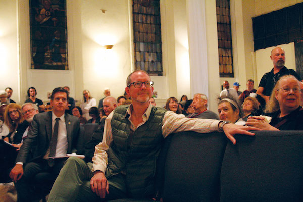Residents Riled by Eminent Domain Scenario for Bus Terminal Revamp 7 Scott Stearman, center, the pastor at Metro Baptist, said his church provided essential neighborhood services to the Hell’s Kitchen community, including a food pantry, as well as teen and after-school programs. Photo by Yannic Rack.