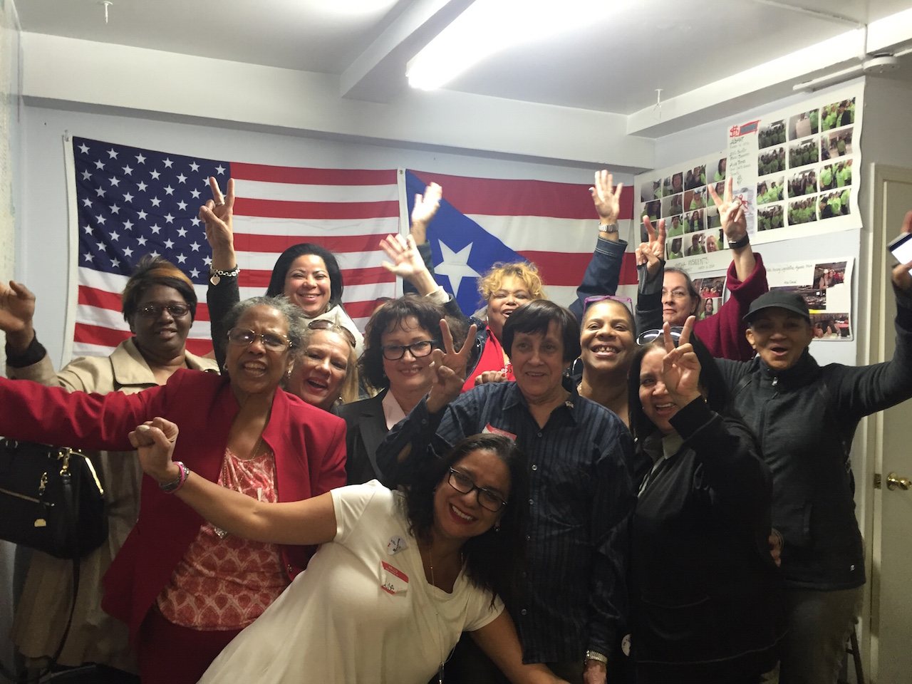 Alice Cancel, middle row, fourth from left, and supporters, celebrate her win in Tuesday's Assembly special election. Photos by Roberto Mercado