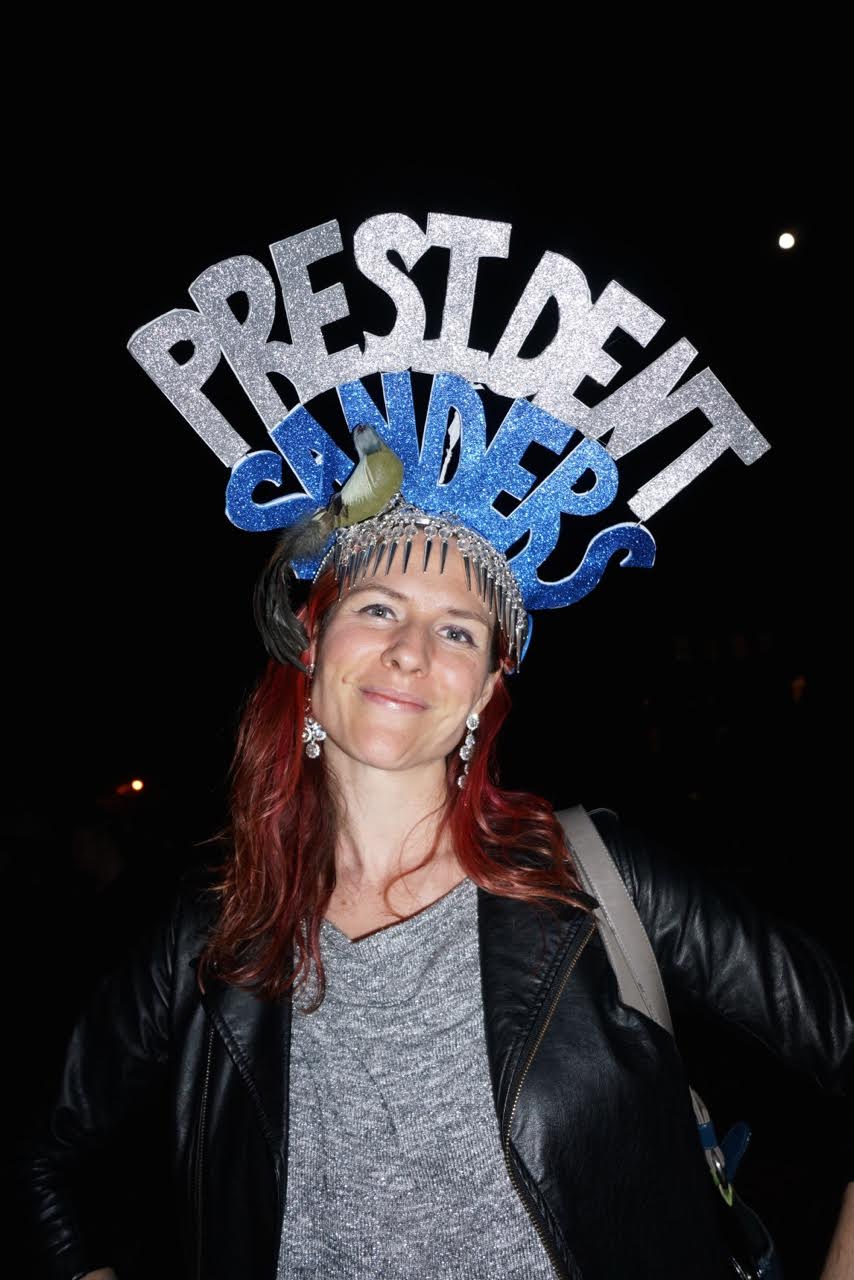 On primary election night, Michelle Palmer wasn’t ready to throw in the towel, or her headdress, at a Bernie BBQ at La Plaza Cultural. Photo by Sarah Ferguson
