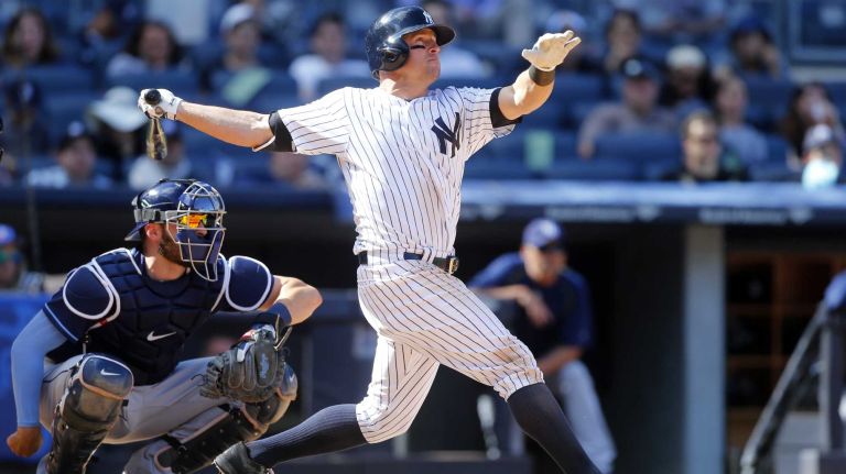 Yankees vs. Rays 89 Brett Gardner #11 of the New York Yankees follows through on his ninth inning game winning home run against the Tampa Bay Rays at Yankee Stadium on Saturday, April 23, 2016 in the Bronx Borough of New York City.