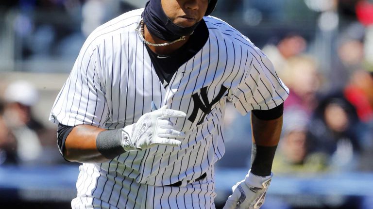 Opening Day: Yankees vs. Astros 35 Starlin Castro #14 of the New York Yankees runs out his second inning two run double against the Houston Astros on Opening Day at Yankee Stadium on Tuesday, Apr. 5, 2016 in the Bronx Borough of New York City.