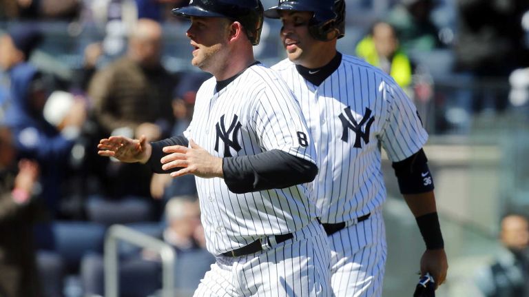 Opening Day: Yankees vs. Astros 40 Brian McCann #34 and Carlos Beltran #36 of the New York Yankees react after both scored in the second inning against the Houston Astros on a double from Starlin Castro on Opening Day at Yankee Stadium on Tuesday, Apr. 5, 2016 in the Bronx Borough of New York City.