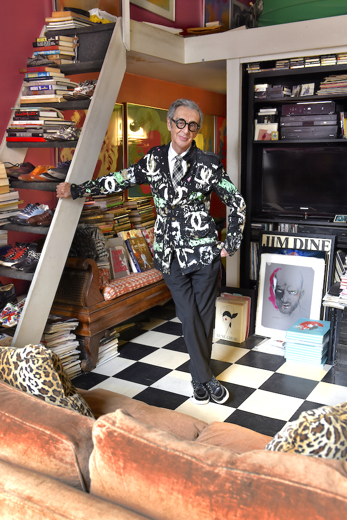 Robert Richards, wearing a hand-painted jacket by Scooter LaForge, standing in the spot where he will later be sleeping. Apart from the bathroom and tiny kitchen, this is his entire living space.  Photo by Bob Krasner