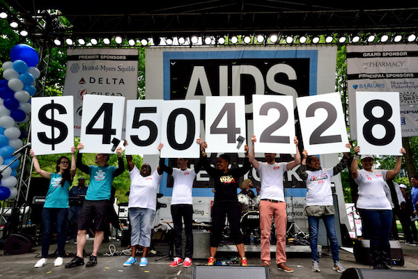 From the stage at the conclusion of the AIDS Walk, the dollar total of funds raised is on display. | DONNA ACETO 