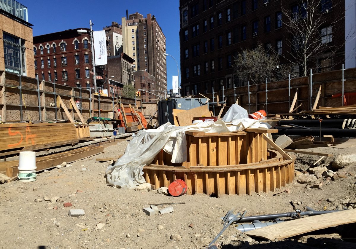 As this photo, taken two weeks ago, shows, construction is not too far along on the AIDS memorial at the former St. Vincent’s Triangle. The new park on the triangle, meanwhile, was completed eight months ago. Photo by Tequila Minsky