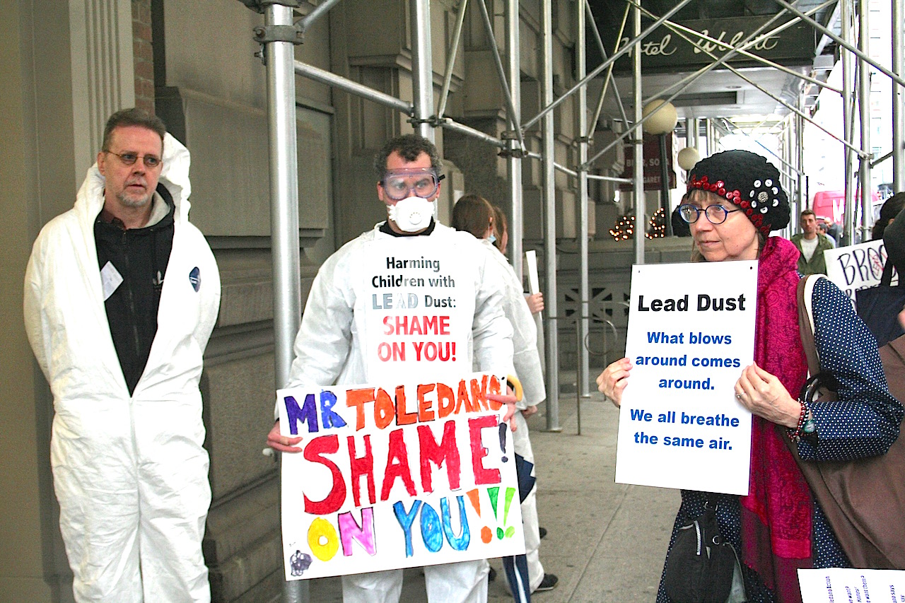 ‘I’ll get the lead out,’ ‘Heavy Metal’ Toledano tells pols, Health Dept. 1 Tenants from three Toledano-owned East Village buildings, some wearing hazmat suits and dust masks, protested outside their landlord’s Union Square-area offices last month, urging him to use legally required lead-abatement procedures. Photo by Yannic Rack
