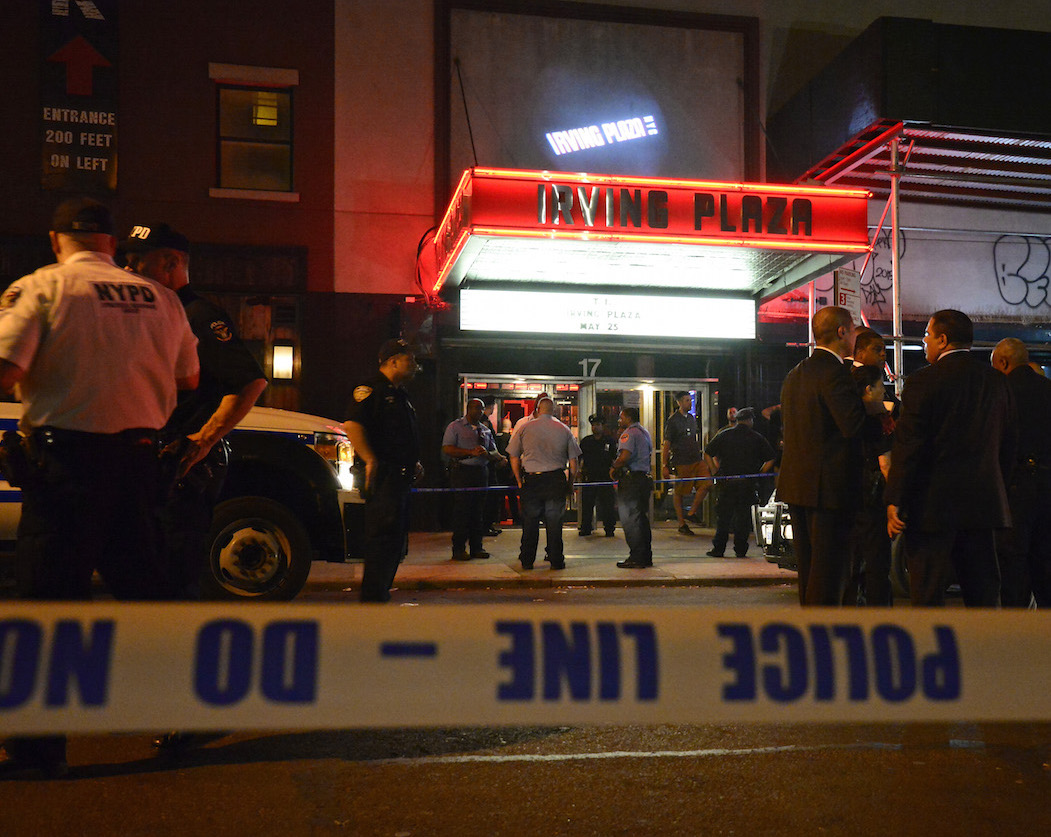 Police offices, detectives and emergency personnel responded to Irving Plaza, at E. 15th St. and Irving Place, on Wednesday evening after deadly gunfire broke out at a rap concert. At the time of this photo, the victims had already been removed from the scene. Photo by Jefferson Siegel