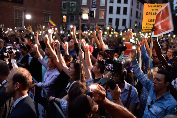 Crowds thronged to Christopher Street outside the Stonewall Inn on Monday evening in a vigil for the Orlando victims. | DONNA ACETO 