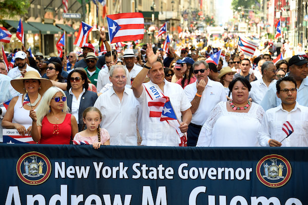 Governor Andrew Cuomo marching with Fernando Ferrer, the former Democratic Bronx borough president who in 2005 was the first major party Puerto Rican candidate for mayor.