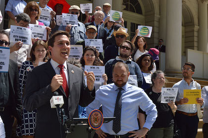 City Councilmembers Ben Kallos (speaking) and Corey Johnson at a June 6 rally in opposition to a new landmarking bill approved by the Council two days later. | JACKSON CHEN