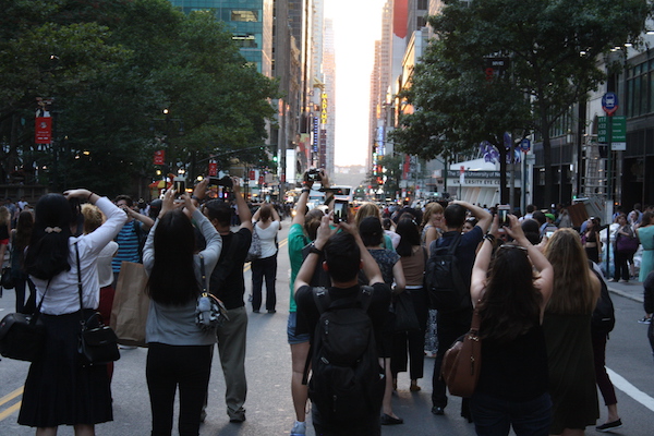 Will 61st Century Humans Ponder Manhattanhenge Creators’ Genius? 2 Manhattanhenge fans capture 42nd Street on June 12 to capture the magic moment of sunset. | MICHAEL SHIREY