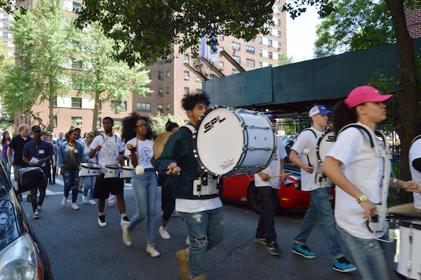 The West Side High School band led the parade to the Rockwell street sign commemoration. | JACKSON CHEN 