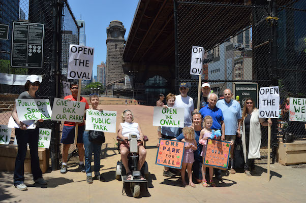 Parks Department Now Open to Returning Queensboro Oval to Public Control 2 Community residents and CB8 members just outside the entrance to Queensboro Oval at a June 25 rally demanding that the park be opened up to the public. | JACKSON CHEN