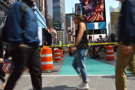 Designated Zones Open in Times Square, As Superheroes Ready a Legal Battle 3 One of the “Techno Teal”-painted DAZs, at 46th Street and Broadway, with the installation barriers and yellow take not yet removed. | JACKSON CHEN