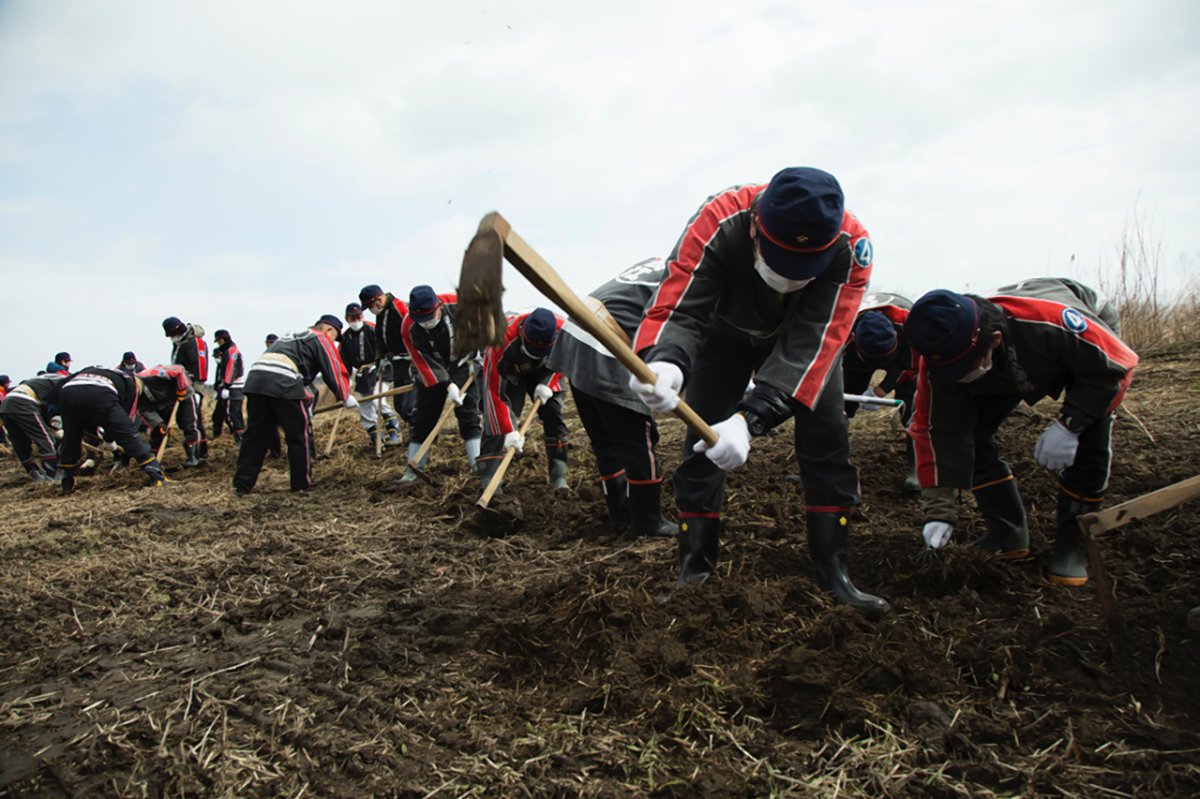  On the fifth anniversary of Japan's 2011 monster earthquake and tsunami, firefighters of local fire departments of Fukushima looked for the remains of victims in Ukedo in Namie, one of the evacuation zones due to radiation from the damaged Fukushima nuclear plant. Photo by Q. Sakamaki