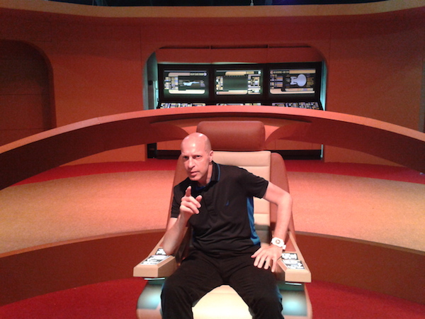 Villager arts editor Scott Stiffler, loving the power that comes with the Captain’s chair — a logical reaction, for those visiting this mostly accurate recreation of the bridge from “Star Trek: The Next Generation.” Photo by Danny Burke.