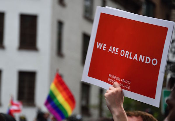 Stonewall Vigil for Orlando Victims Pivots to Gun Control Rally 3 Thousands voiced solidarity with the Orlando bar victims and survivors at the Stonewall on June 13.